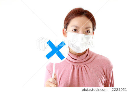 A woman with a mask to put out a mask A woman with a mask to put out a mask 2223951