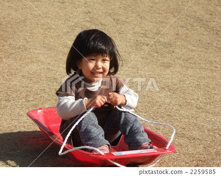 Girl playing with lawns skiing 2259585