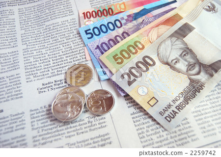 Indonesian currency and newspaper 2259742