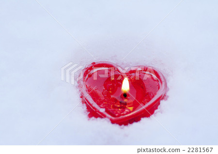 Heart shaped candle in the snow 2281567