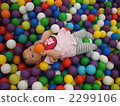 A girl lying on a colorful ball pool 2299106