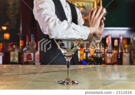 Bartender working with cocktail glass 2312816