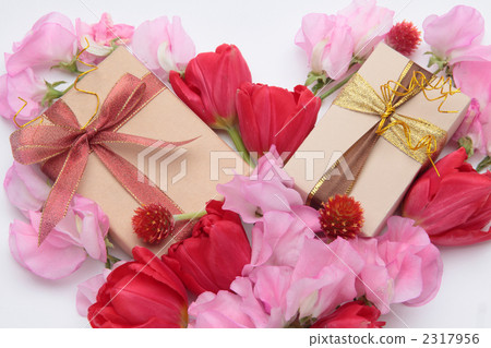 Flowers and gifts arranged in heart shape 2317956