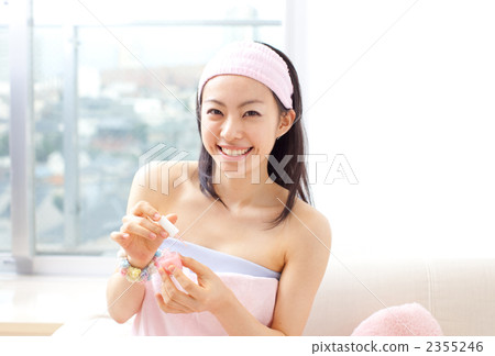 Women painting nail polish 2355246