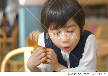 Drink juice with a straw 2373714