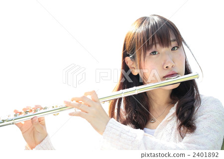 A young lady blowing a flute 2401892