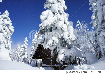 Snowy landscape and mountain huts Snowy landscape and mountain huts 2402789
