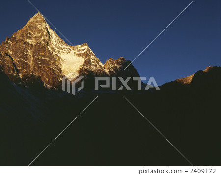 Morning glow of cajori peak (6186 m) at Nepal Matchello Morning glow of cajori peak (6186 m) at Nepal Matchello 2409172