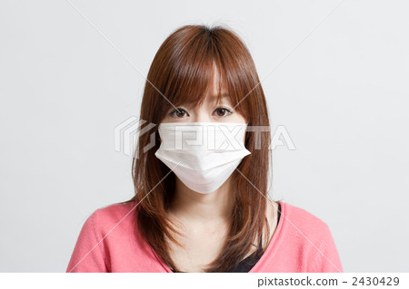 A woman wearing a mask A woman wearing a mask 2430429