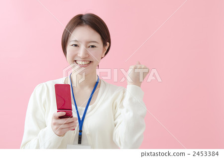 A woman wearing an ID card on her neck A woman wearing an ID card on her neck 2453384