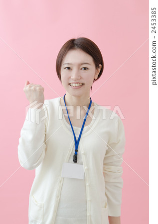 A woman wearing an ID card on her neck A woman wearing an ID card on her neck 2453385