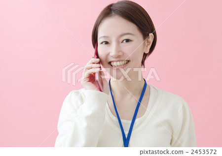 A woman wearing an ID card on her neck 2453572