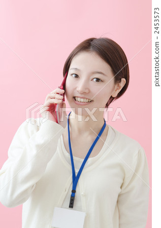A woman wearing an ID card on her neck A woman wearing an ID card on her neck 2453573