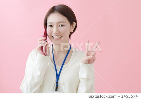 A woman wearing an ID card on her neck A woman wearing an ID card on her neck 2453574