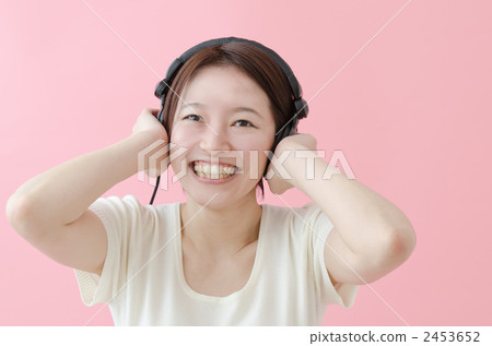 A woman listening to music 2453652