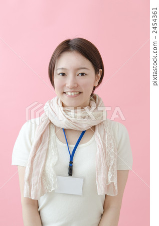 A woman wearing an ID card on her neck 2454361