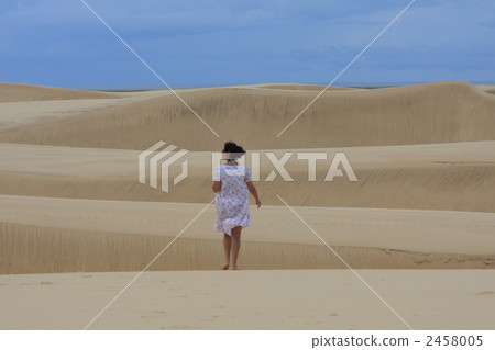 A woman in white sand dune A woman in white sand dune 2458005