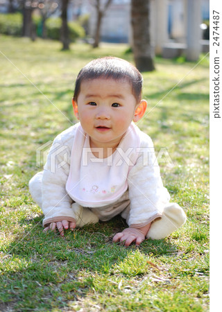 Baby sitting on the lawn Baby sitting on the lawn 2474487