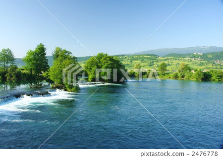 A village with ancient castle of Bihach and a clear stream with a splendid waterfall A village with ancient castle of Bihach and a clear stream with a splendid waterfall 2476778