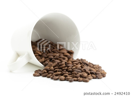 Coffee beans spilled from the cup Coffee beans spilled from the cup 2492410