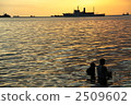 Sunset and people in Manila Bay 2509602