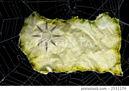 Spider thread and old paper sun symbol 2531174