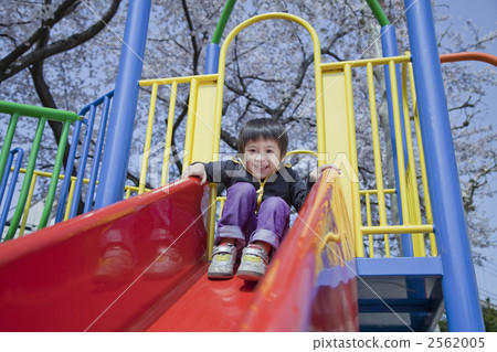 Children playing on the slide 2562005