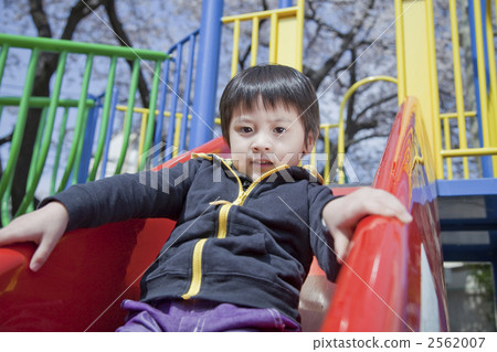 Boy playing on the slide 2562007
