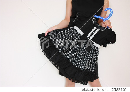 A woman with a dress for children A woman with a dress for children 2582101