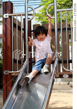 Boy playing on the slide Boy playing on the slide 2718538