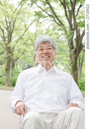 Senior walking in the park with wheelchair Senior walking in the park with wheelchair 2718922