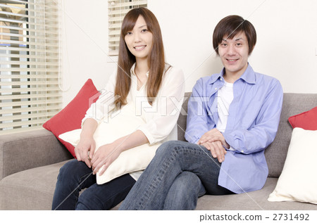A couple sitting on the sofa A couple sitting on the sofa 2731492