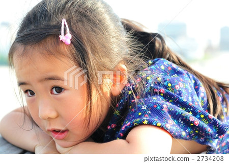 Child who lies on wood deck Child who lies on wood deck 2734208