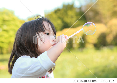 Three-year-old girl playing with shababonda 2820546