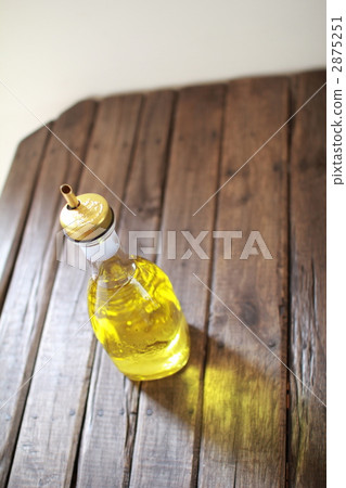 Olive oil poured into a glass bottle 2875251