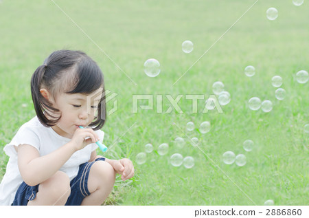 Girl playing soap bubbles 2886860