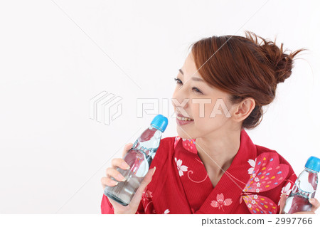 A woman with a ramune and a yukata A woman with a ramune and a yukata 2997766