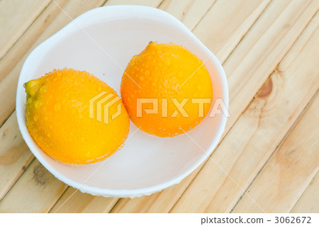 Lemon on a wooden desk Lemon on a wooden desk 3062672
