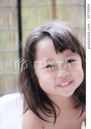 A 3 year old girl who enters a water bath outside A 3 year old girl who enters a water bath outside 3074804