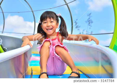 Girl playing on the slide 3147784