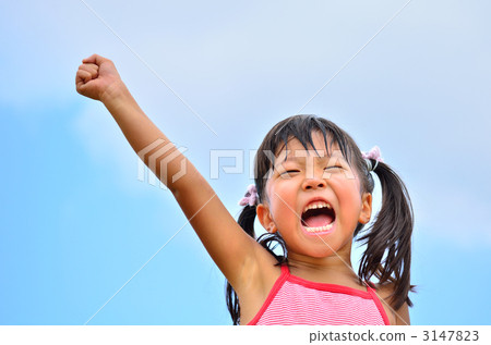 A girl raising her hand up in the blue sky 3147823