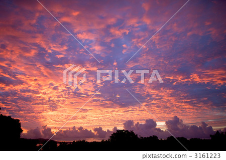 Summer sky of Taketomijima stained with orange color in the morning glow 3161223