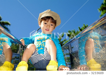 Children playing on the slide 3233689
