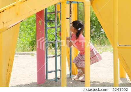 Girls playing with park play equipment 3241992