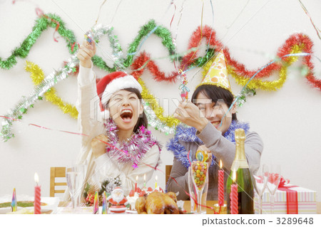 heterosexual couple, partying, noisemaker 3289648