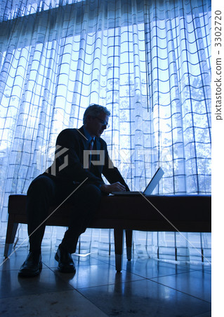 Businessman with laptop. 3302720