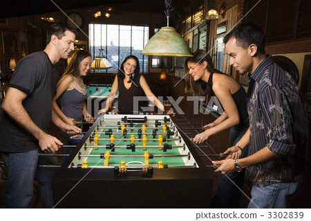 Group of People Playing Foosball Group of People Playing Foosball 3302839