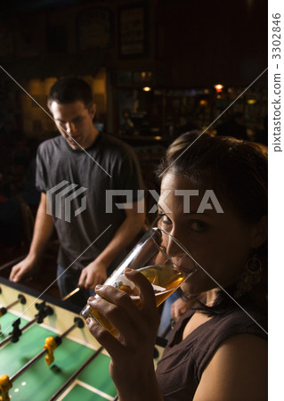 Woman drinking beer. Woman drinking beer. 3302846