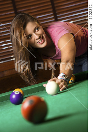 Young Woman Playing Billiards Young Woman Playing Billiards 3302852