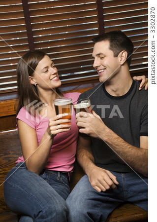 Couple Toasting Their Beers Couple Toasting Their Beers 3302870